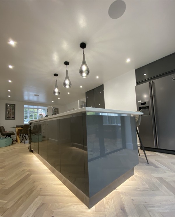 Finished kitchen with island pendant lights and LED downlights